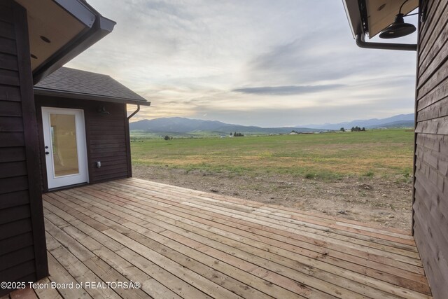 969 Caribou Peak Loop, Etna, WY 83118 - wooden deck featuring a mountain view and a view of rural / pastoral area