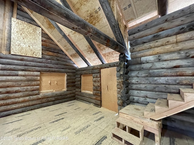 777 Richardson Creek Rd, Afton, WY 83110 - stairs with rustic walls and lofted ceiling