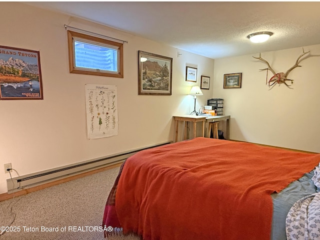 335 E Hansen Ave, Jackson, WY 83001 - bedroom featuring baseboard heating and carpet floors