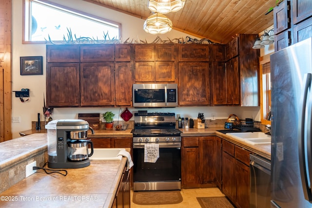 362 Snowmobile Ln, Daniel, WY 83115 - kitchen featuring stainless steel appliances, wood ceiling, lofted ceiling, and tile countertops