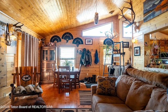 362 Snowmobile Ln, Daniel, WY 83115 - living room with wood walls, wood ceiling, vaulted ceiling, and hardwood / wood-style floors