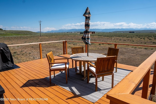 362 Snowmobile Ln, Daniel, WY 83115 - wooden deck with a view of countryside, a mountain view, and outdoor dining area
