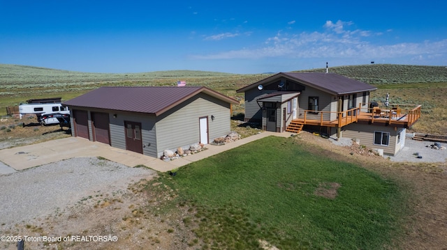 362 Snowmobile Ln, Daniel, WY 83115 - view of front of property with a detached garage, a deck, an outbuilding, and a metal roof