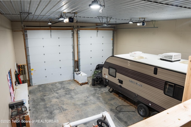 362 Snowmobile Ln, Daniel, WY 83115 - garage featuring a garage door opener