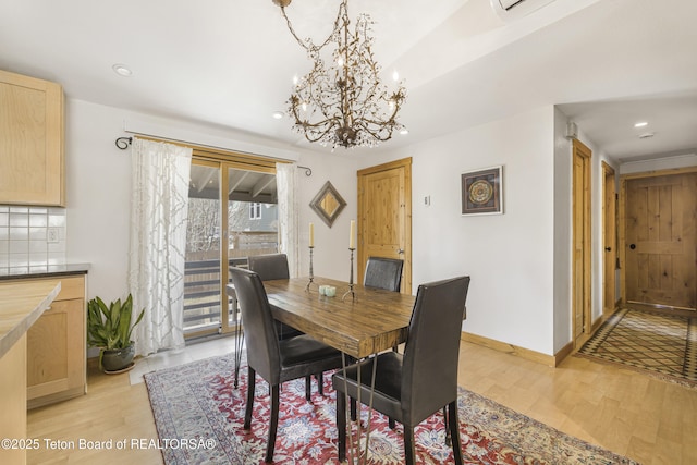 30 Stormy Cir, Jackson, WY 83001 - dining space featuring light wood-style floors, recessed lighting, a notable chandelier, and baseboards