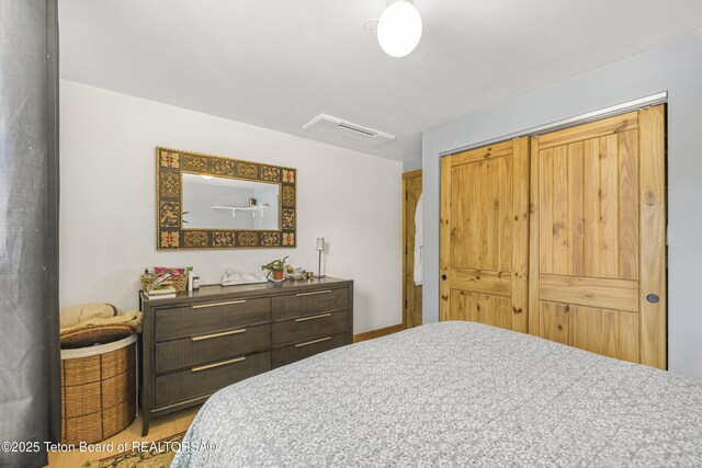 30 Stormy Cir, Jackson, WY 83001 - bedroom with visible vents, wood finished floors, and a closet