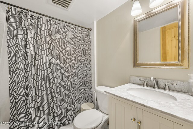 30 Stormy Cir, Jackson, WY 83001 - bathroom with toilet, curtained shower, visible vents, and vanity
