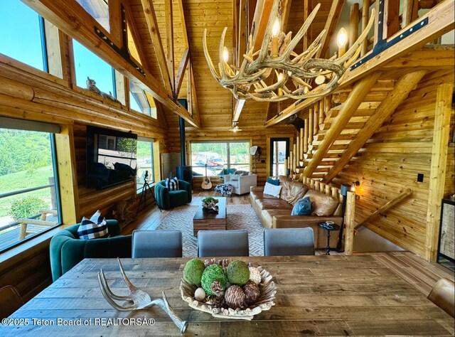 800 Dell Crk, Alpine, WY 83128 - living room with high vaulted ceiling, beam ceiling, a chandelier, wood-type flooring, and wooden ceiling