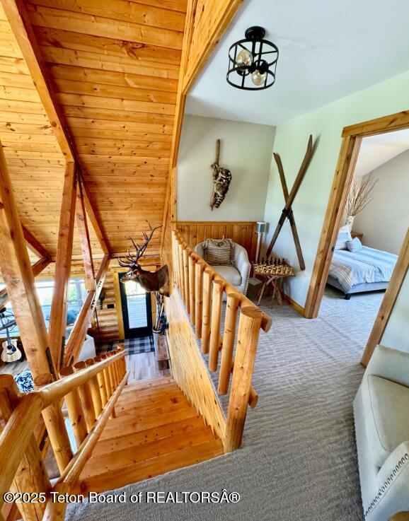 800 Dell Crk, Alpine, WY 83128 - stairway with a chandelier and wood finished floors