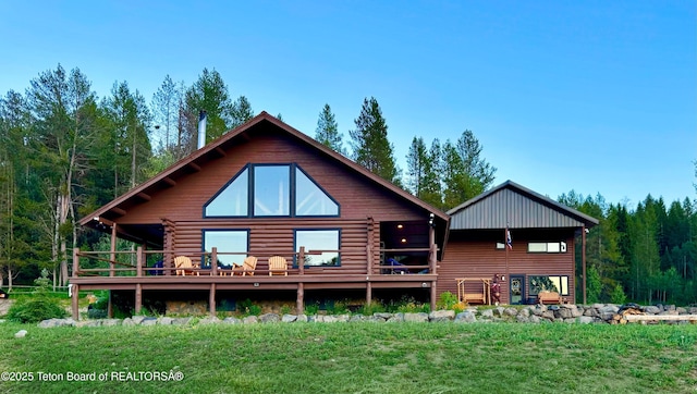 800 Dell Crk, Alpine, WY 83128 - rear view of property with log exterior, a yard, and a wooden deck