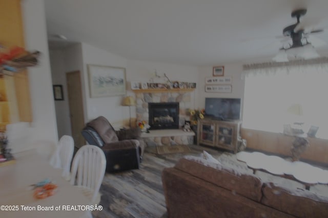 10 Foothill Blvd, Alpine, WY 83128 - living area featuring a fireplace, a ceiling fan, and wood finished floors