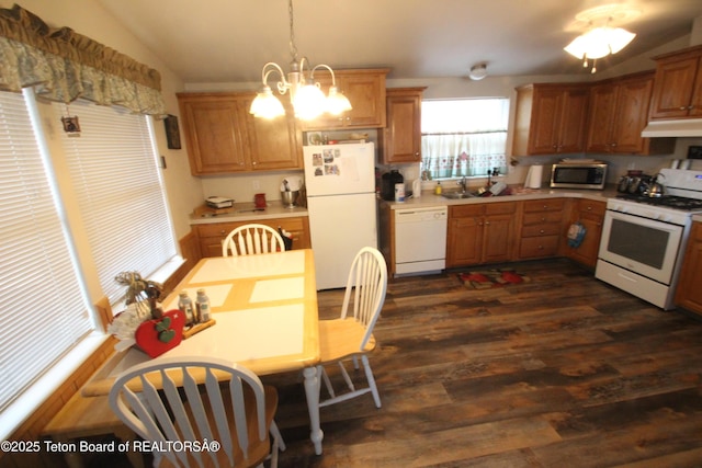 10 Foothill Blvd, Alpine, WY 83128 - kitchen with lofted ceiling, under cabinet range hood, white appliances, dark wood finished floors, and light countertops