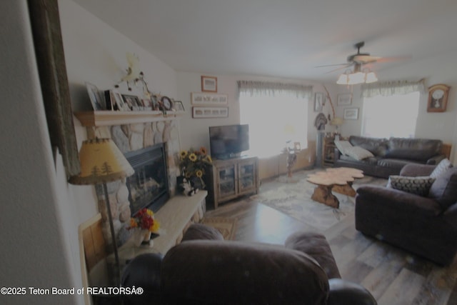 10 Foothill Blvd, Alpine, WY 83128 - living area with a fireplace, ceiling fan, and wood finished floors
