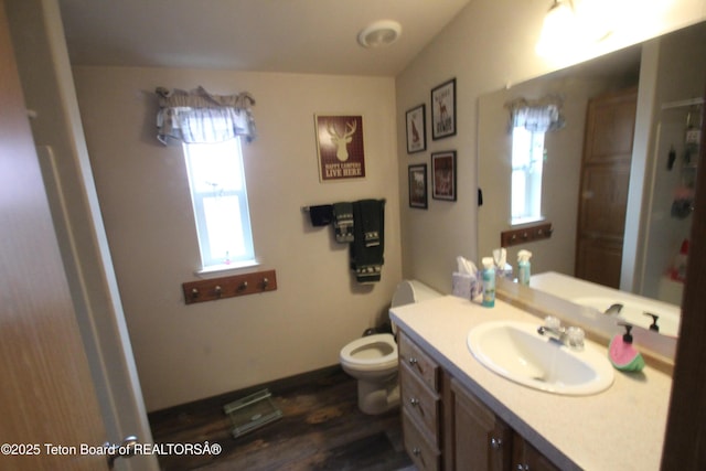 10 Foothill Blvd, Alpine, WY 83128 - bathroom featuring vanity, toilet, and wood finished floors