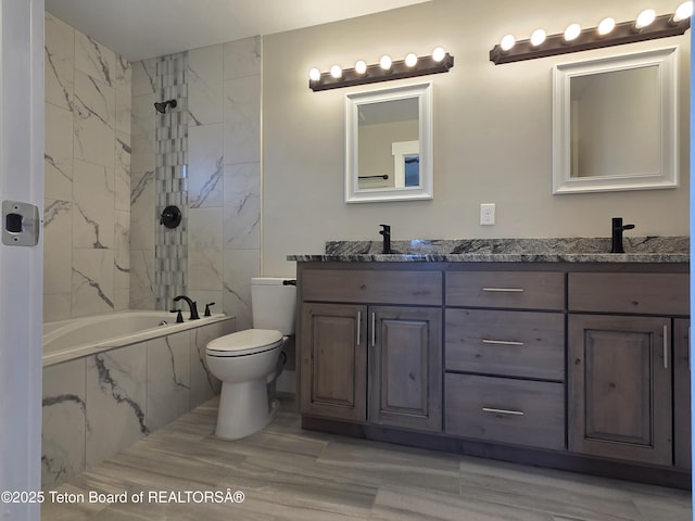 564 Palisade Trl, Driggs, ID 83422 - full bathroom with double vanity, a combined bath / shower with marble appearance, toilet, and a sink