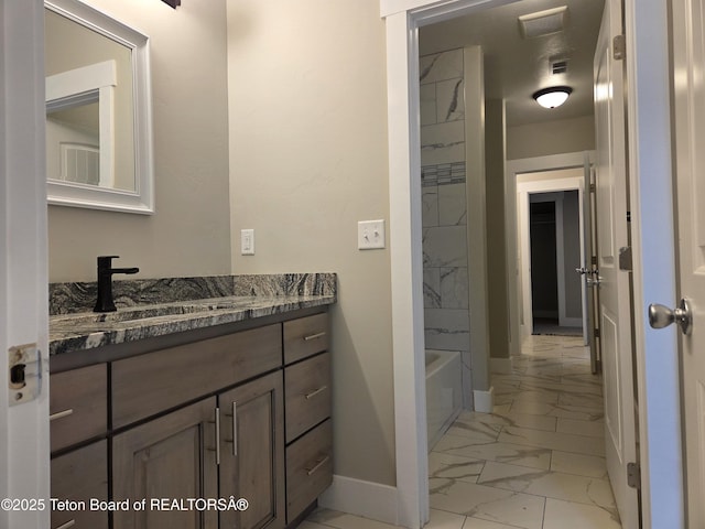 564 Palisade Trl, Driggs, ID 83422 - bathroom with vanity, baseboards, visible vents, and marble finish floor