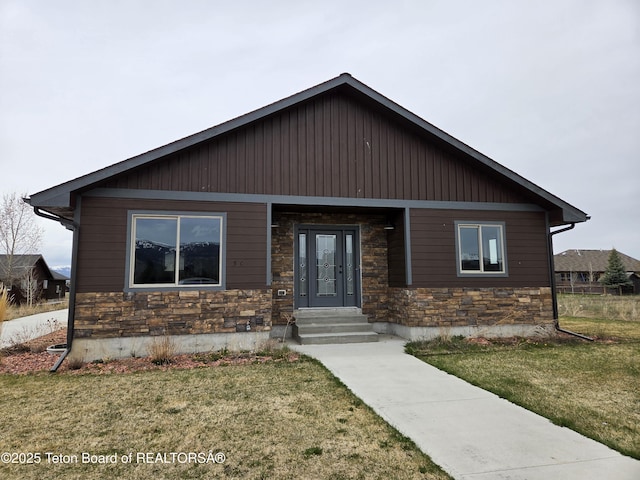 564 Palisade Trl, Driggs, ID 83422 - view of front of property featuring entry steps, a front yard, and stone siding