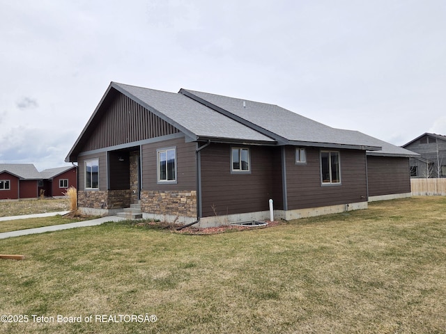 564 Palisade Trl, Driggs, ID 83422 - view of property exterior with a lawn, roof with shingles, and stone siding