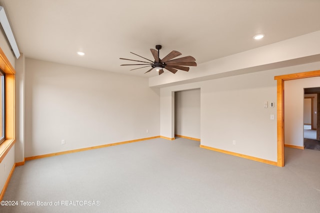 spare room with carpet floors, recessed lighting, baseboards, and a ceiling fan
