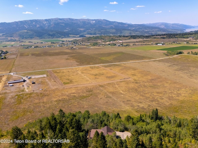 aerial view featuring a mountain view and a rural view
