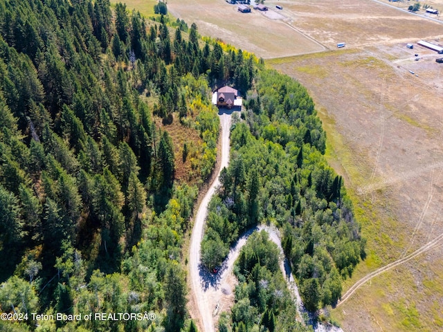 birds eye view of property featuring a rural view