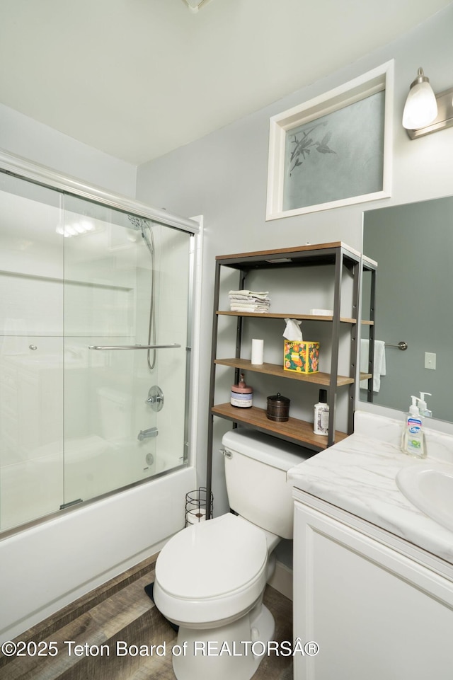 811 Jade St, Pinedale, WY 82941 - bathroom with toilet, bath / shower combo with glass door, and vanity