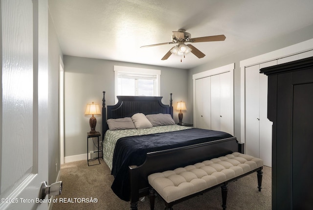 811 Jade St, Pinedale, WY 82941 - carpeted bedroom featuring multiple closets, baseboards, and ceiling fan