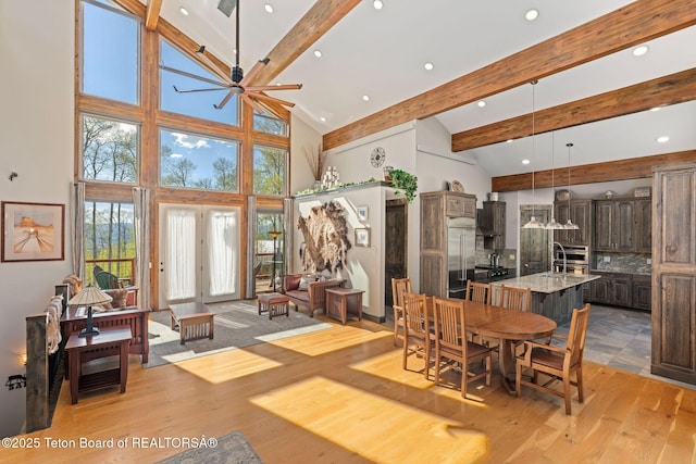 dining room with ceiling fan, light wood-style flooring, beamed ceiling, and recessed lighting