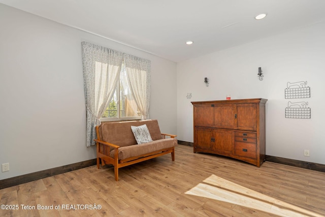 sitting room with light wood-style floors, baseboards, and recessed lighting