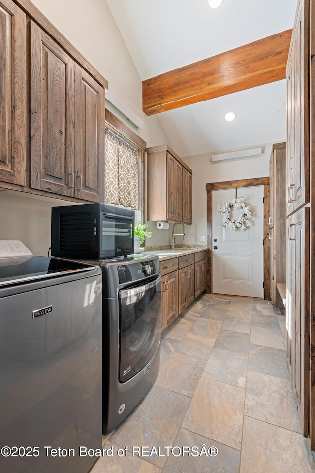 laundry room with cabinet space, independent washer and dryer, and recessed lighting