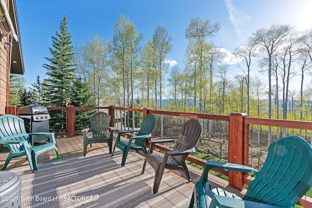 wooden terrace featuring grilling area