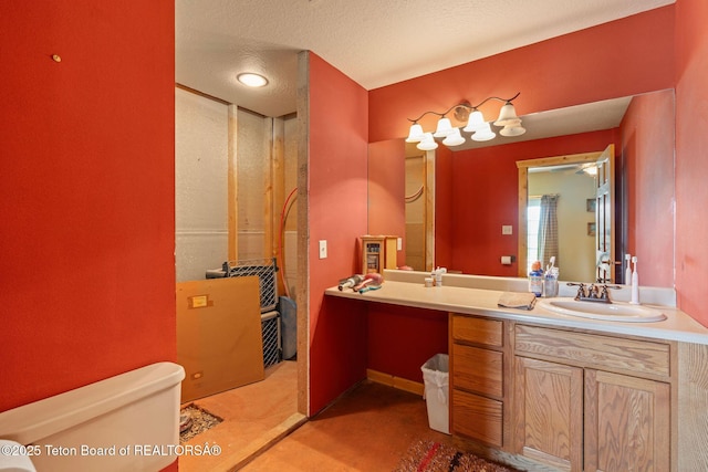 86 Hawks Rest Rd, Etna, WY 83118 - bathroom with toilet, vanity, and a textured ceiling
