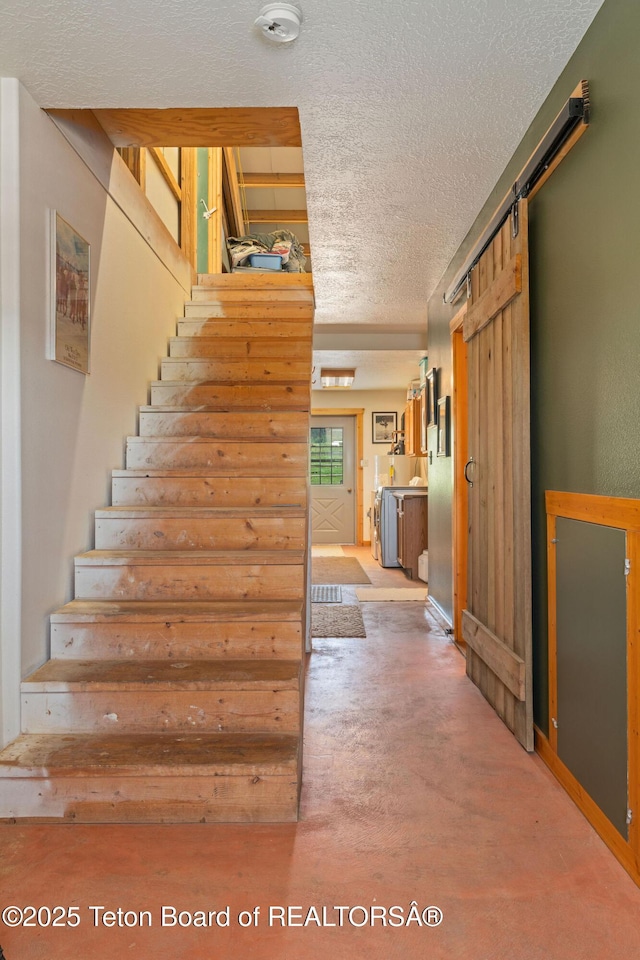 86 Hawks Rest Rd, Etna, WY 83118 - staircase with a textured ceiling and a barn door