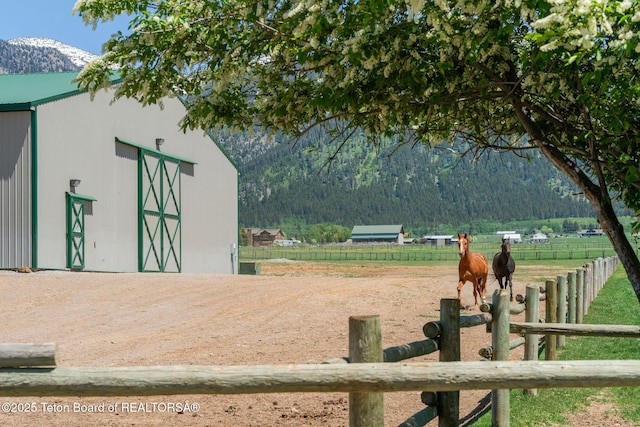 86 Hawks Rest Rd, Etna, WY 83118 - surrounding community with an outbuilding, a mountain view, a view of countryside, and a view of trees