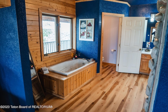 4 Beaver Ridge Rd, Daniel, WY 83115 - bathroom featuring a tub with jets, wood finished floors, toilet, and vanity
