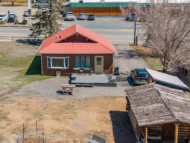 611 W Ramshorn St, Dubois, WY 82513 - rear view of property featuring a deck and metal roof