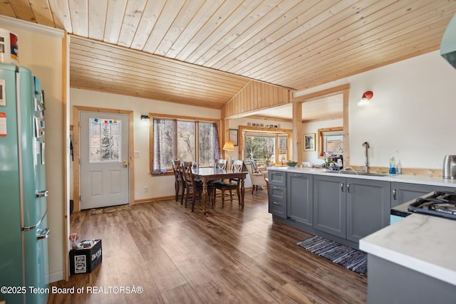 611 W Ramshorn St, Dubois, WY 82513 - kitchen featuring freestanding refrigerator, wooden ceiling, gray cabinetry, light countertops, and wood finished floors