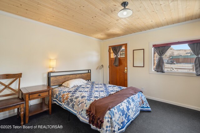 611 W Ramshorn St, Dubois, WY 82513 - carpeted bedroom with ornamental molding, wood ceiling, and baseboards