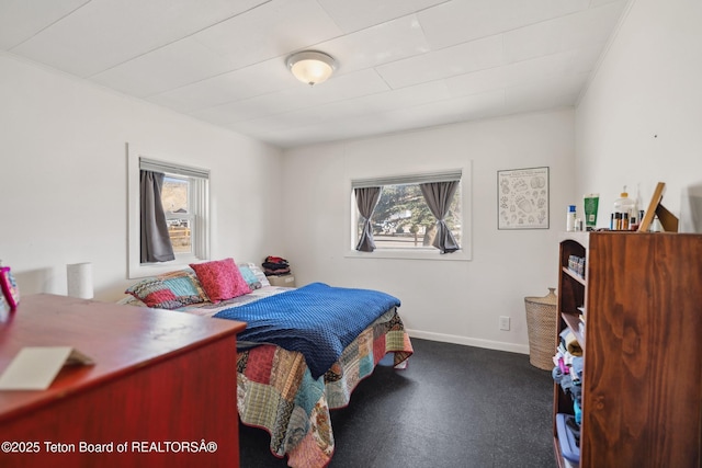 611 W Ramshorn St, Dubois, WY 82513 - bedroom featuring dark carpet and baseboards