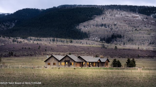 view of mountain feature featuring a rural view and a wooded view