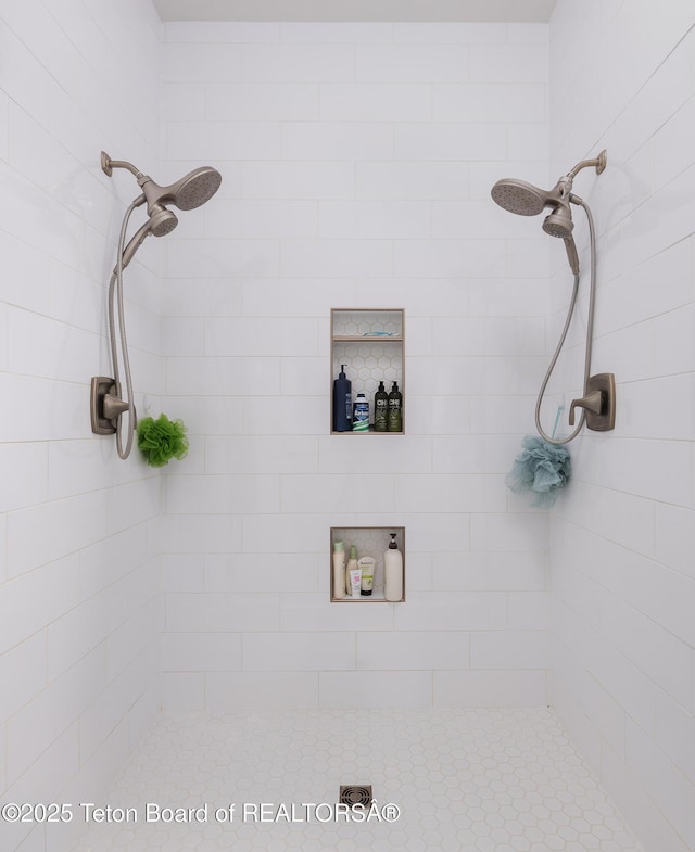 full bath featuring a tile shower
