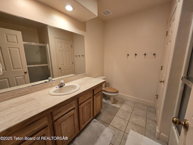 full bathroom with a stall shower, baseboards, visible vents, tile patterned flooring, and vanity