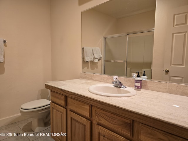 full bathroom with a stall shower, toilet, baseboards, tile patterned flooring, and vanity