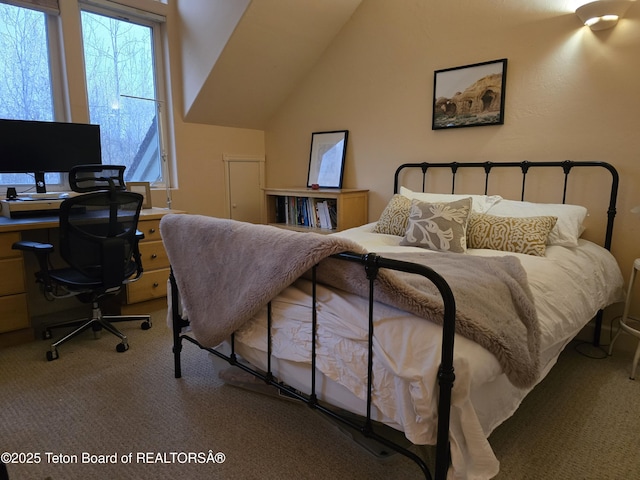 carpeted bedroom featuring vaulted ceiling