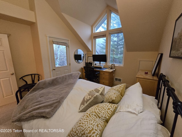 bedroom with visible vents and vaulted ceiling
