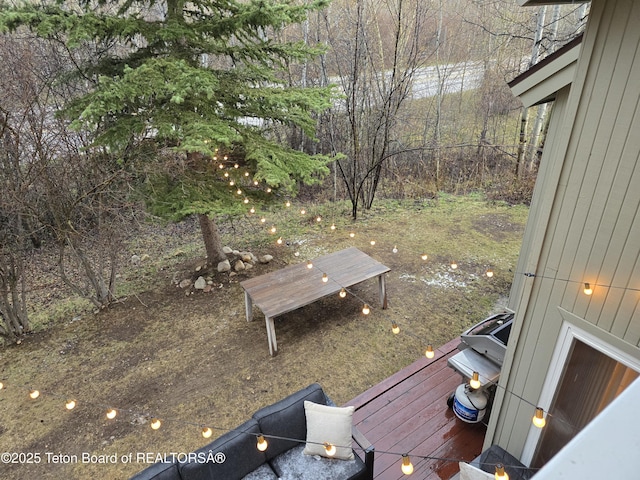 view of yard featuring a wooden deck