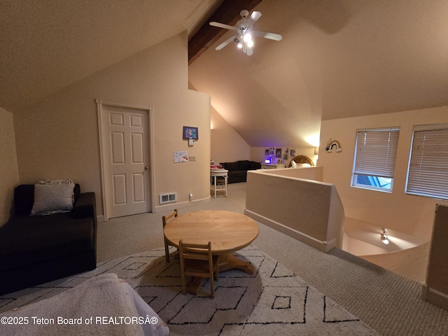 interior space featuring visible vents and vaulted ceiling with beams