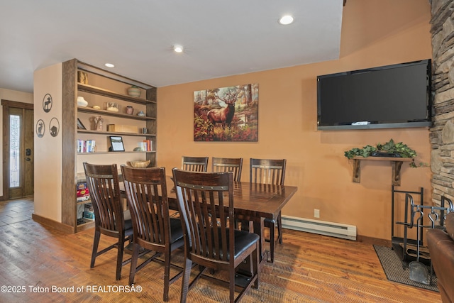 7250 N Rachel Way Unit 6, Teton Village, WY 83025 - dining room with a baseboard radiator, wood finished floors, baseboards, and recessed lighting
