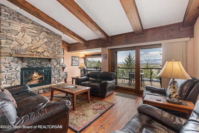 7250 N Rachel Way Unit 6, Teton Village, WY 83025 - living room featuring a stone fireplace and wood finished floors