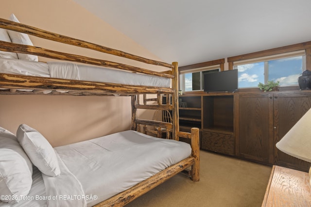 7250 N Rachel Way Unit 6, Teton Village, WY 83025 - bedroom featuring light carpet and lofted ceiling